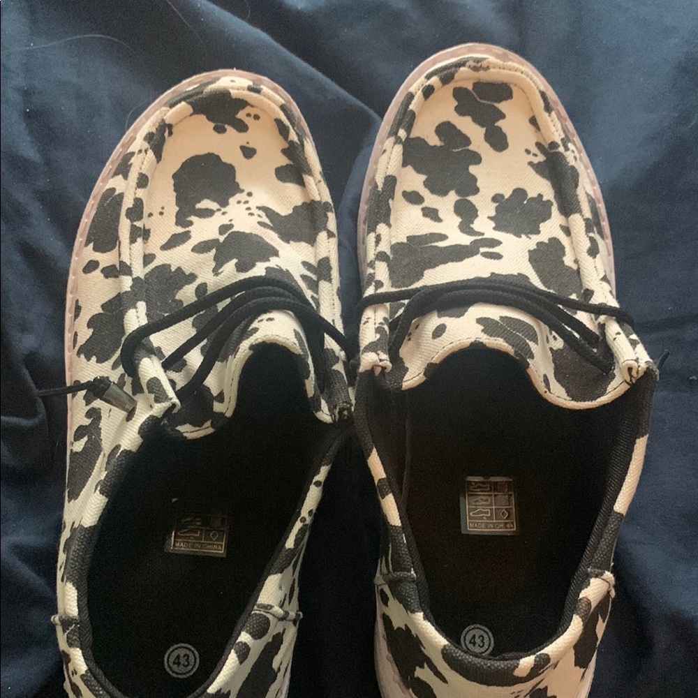 Hey Dude Black and White Cow Print Flats